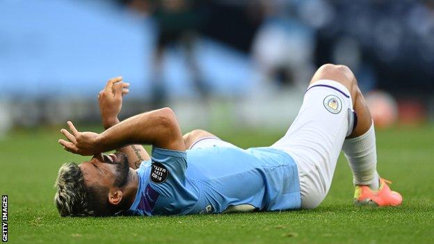 Manchester City striker Sergio Aguero lies down after injuring his knee against Burnley in June