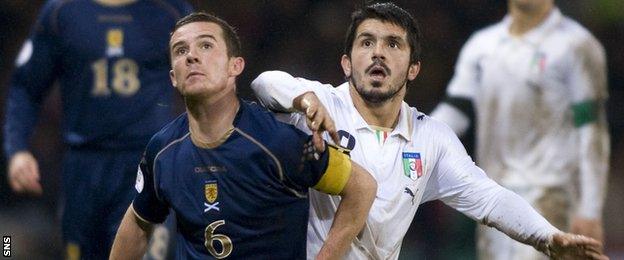 Scotland's Barry Ferguson challenges Italy's Rino Gattuso