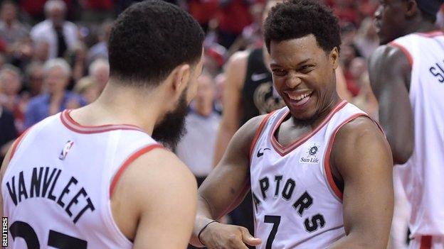 Toronto Raptors guards Kyle Lowry (7) and Fred VanVleet (23) react as the Raptors win