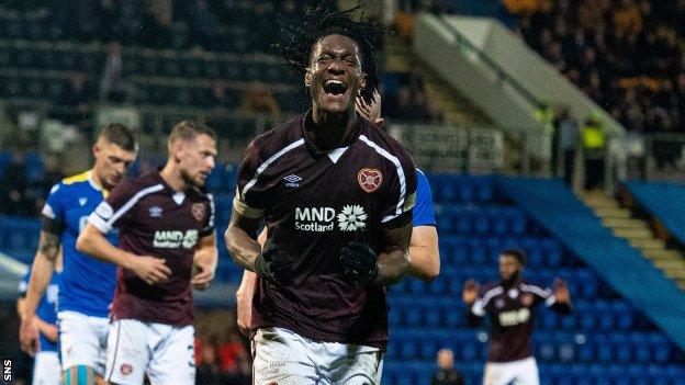 Armand Gnanduillet celebrates scoring for Hearts