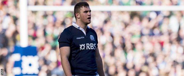 Adam Ashe in action for Scotland