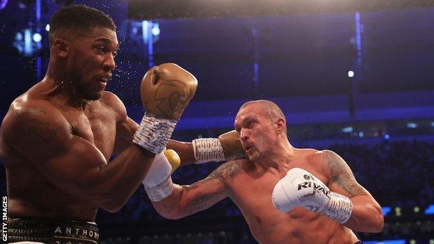 Oleksandr Usyk punches Anthony Joshua