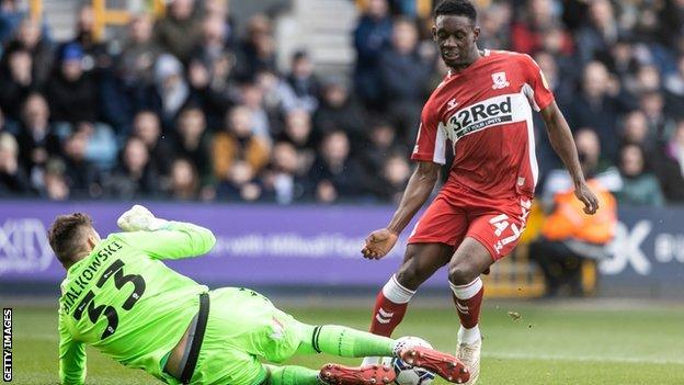 Bartosz Bialkowski, of Millwall, smothers the ball from Folarin Balogun