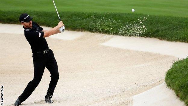 Jimmy Walker chips in from the bunker on the 10th hole