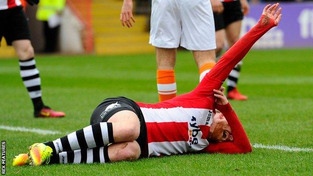 Robbie Simpson lies in agony after breaking his ankle