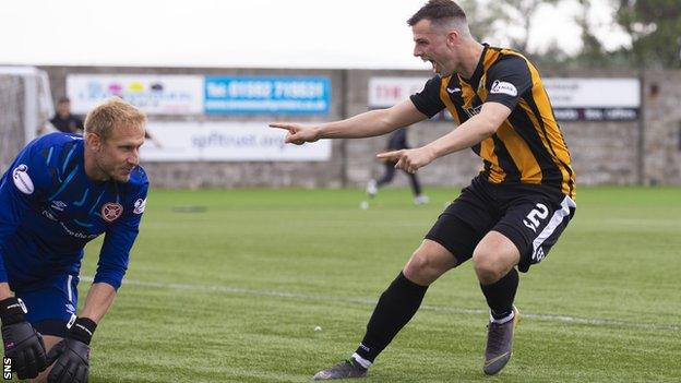 East Fife's Aaron Dunsmore celebrates his winning penalty