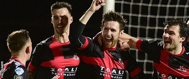 Crusaders celebrate after Howard Beverland gave them the lead in the County Antrim Shield final