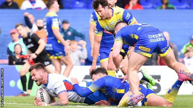 Liam Hood (left) pegged Warrington back for a fourth time as Wakefield sealed victory