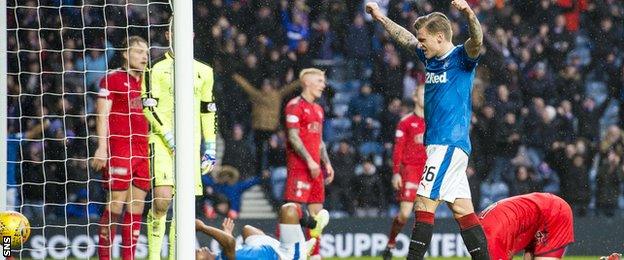 Jason Cummings celebrates after Falkirk's Aaron Muirhead scored an own goal