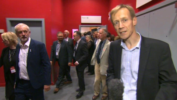 David Cornock reporting, watched by Jeremy Corbyn