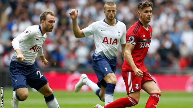 Tom Cairney playing for Fulham against Tottenham