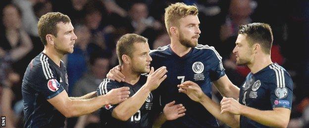 Shaun Maloney is congratulated on helping Scotland draw level against Germany