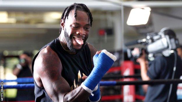 Deontay Wilder trains at an open workout, sticking his tongue out