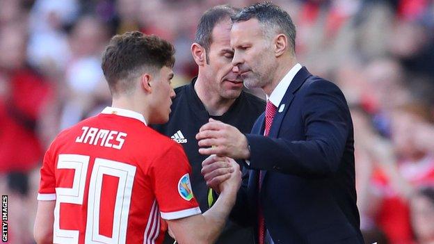 Daniel James (L) and Wales manager Ryan Giggs