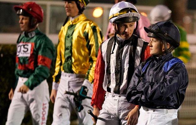 Hollie Doyle, right, with jockeys at Kempton