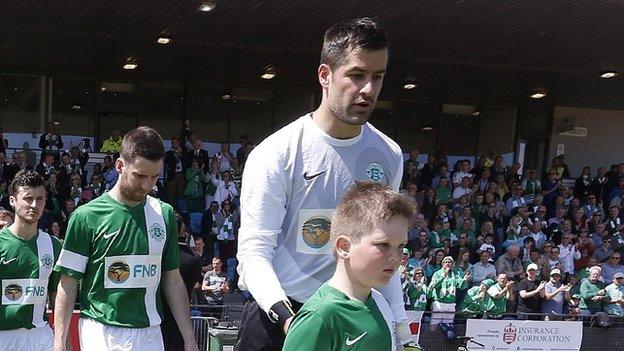 Chris Tardif leads out Guernsey