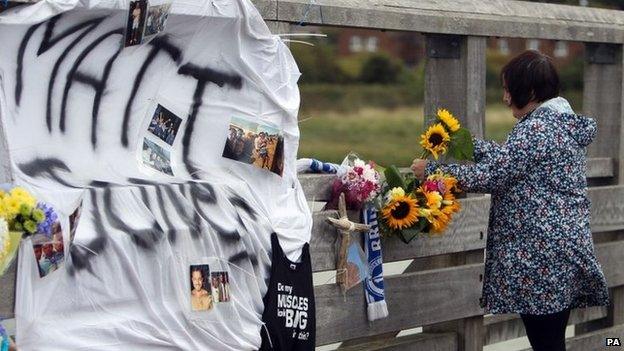 Floral tributes on a bridge near the A27