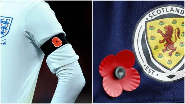 England player wearing poppy armband (left) and Scotland player wearing a poppy in a press conference