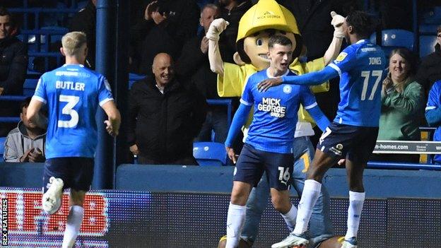 Harrison Burrows (centre) scored his first goal for Peterborough United this season