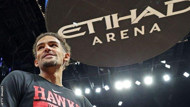 Atlanta Hawks' guard Trae Young attends a press conference ahead of the NBA pre-season game between Milwaukee Bucks and Atalanta Hawks at Etihad Arena on Yas Island in Abu Dhabi