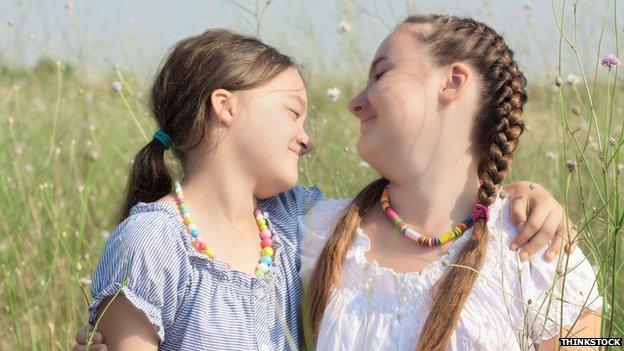 Girls playing in a field