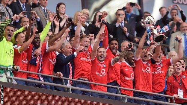 York City's players lift the FA Trophy