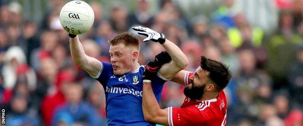 Monaghan's Ryan McAnespie and Tiernan McCann of Tyrone battle for possession