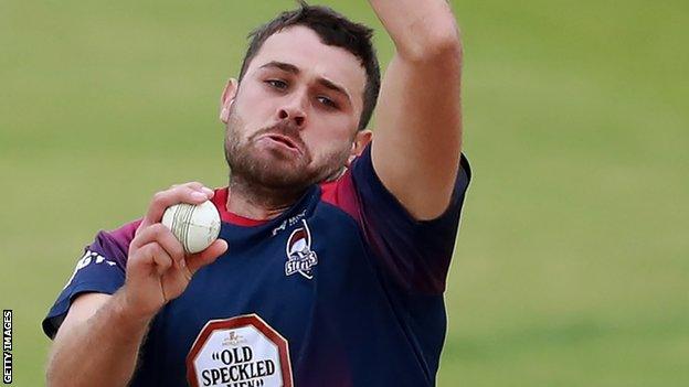 Nathan Buck bowls for Northants