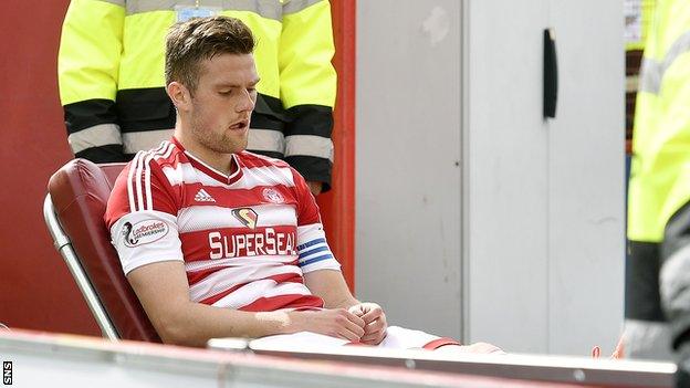 Hamilton Academical defender Michael Devlin is stretchered off