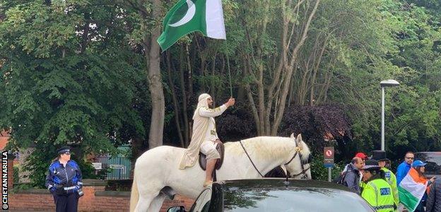 A Pakistan supporter arrives in style