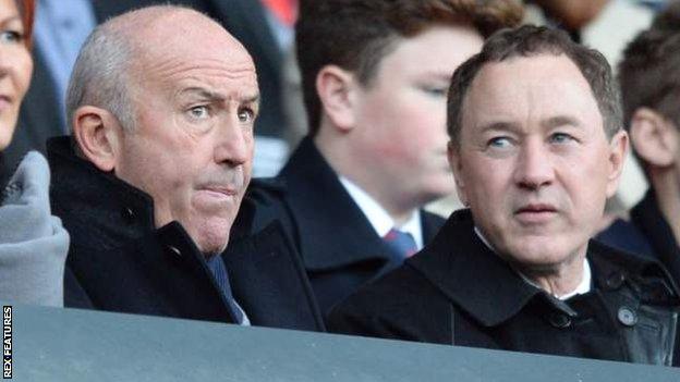 Tony Pulis (left) sits next to Middlesbrough owner Steve Gibson in the stands