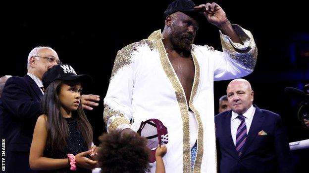 Derek Chisora is joined by his daughters in the ring