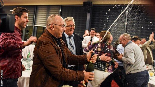 Officials of the Football Federation of Kosovo celebrate in Pristina on May 13, 2016 after the FIFA Congress granted membership to Kosovo"s Football Federation