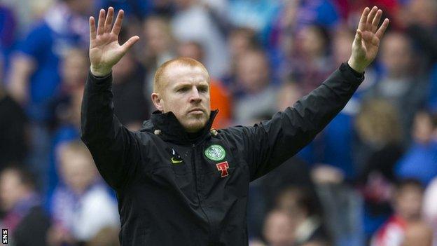 Neil Lennon salutes Celtic fans after a match against Rangers in April 2011