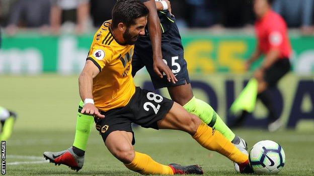 Joao Moutinho in action for Wolves against Manchester City