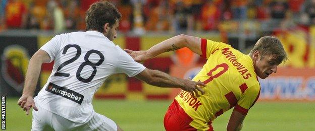 Jagiellonia Bialystok's Arvydas Novikovas (right) in Europa League qualifying action against Dinamo Batumi