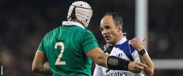 Ireland captain Rory Best talks to referee Jaco Peyper