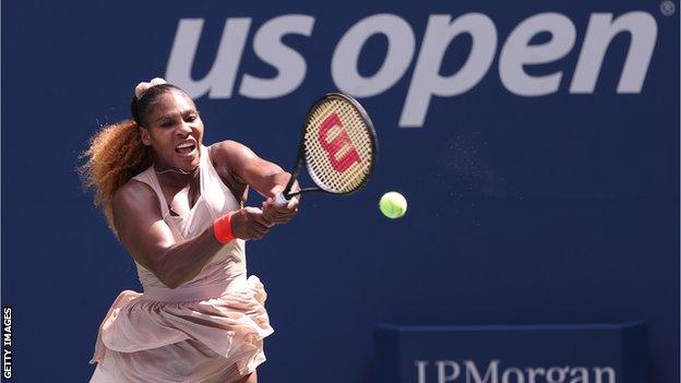 Serena Williams hits a backhand