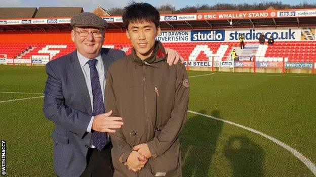 Accrington chairman Andy Holt with Korean fan Jung Min Yoo