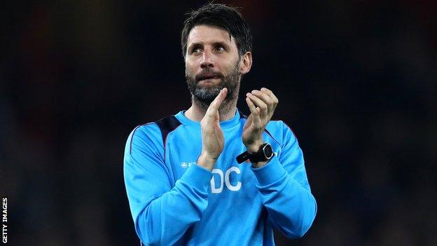 Danny Cowley applauds Lincoln's fans following his side's defeat by Arsenal