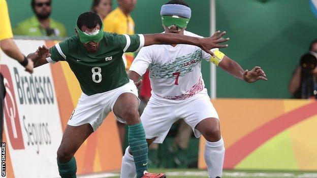 Nonato of Brazil fights for the ball with Hossein Rajabpour of Iran