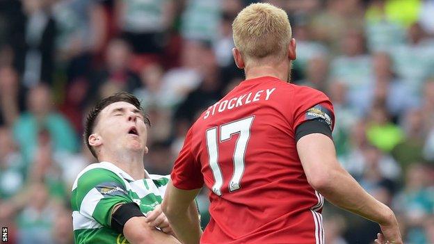 Celtic's Kieran Tierney is caught by Aberdeen striker Jayden Stockley's elbow