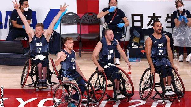 James MacSorley celebrates winning a bronze medal with Great Britain