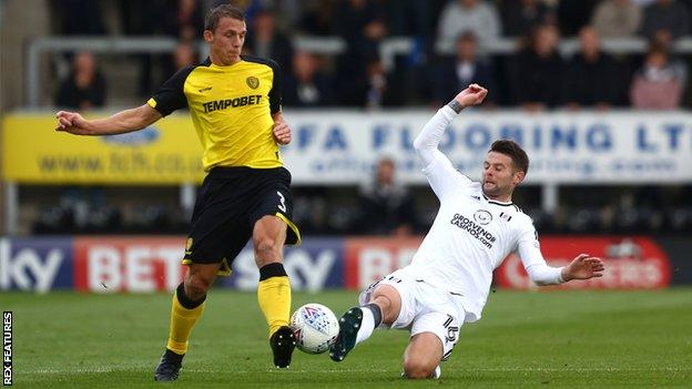 Burton's Stephen Warnock (left) and Oliver Norwood of Fulham