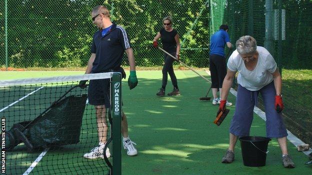 Volunteers keep the courts tidy at Hingham Tennis Club