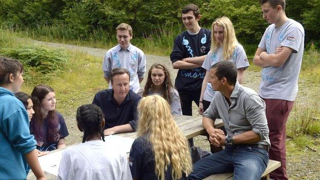 David Cameron and Bear Grylls with young volunteers