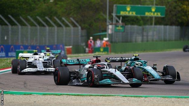 Mercedes' George Russell battles in the midfield during the Emilia Romagna Grand Prix sprint race