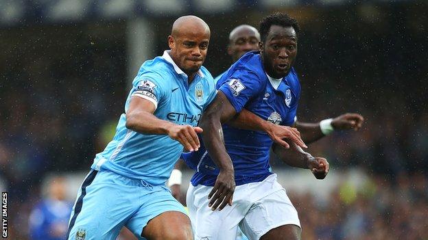 Vincent Kompany battles with Romelu Lukaku