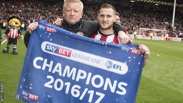 Sheffield United manager Chris Wilder and Billy Sharp celebrate the Blades promotion for League One