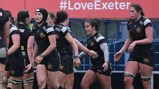 Exeter players celebrate a try